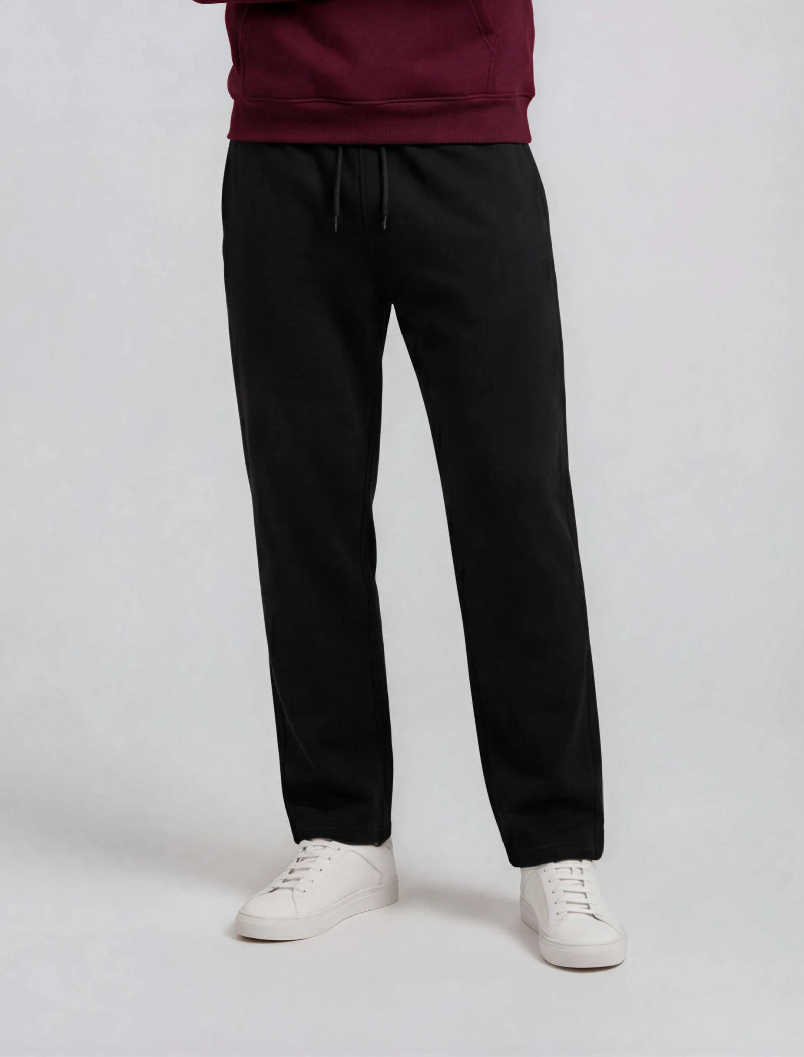 Men's classic track pants in black, front view